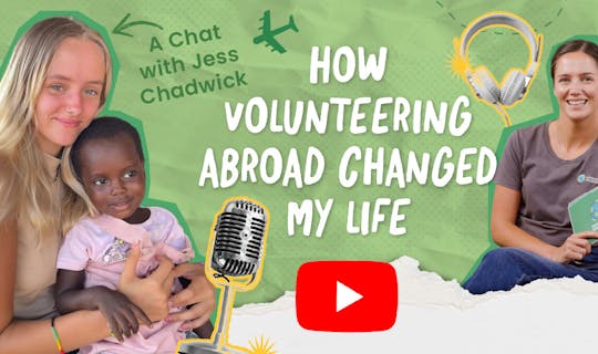 Jess Chadwick speaking into a studio microphone during a podcast interview about volunteering abroad.