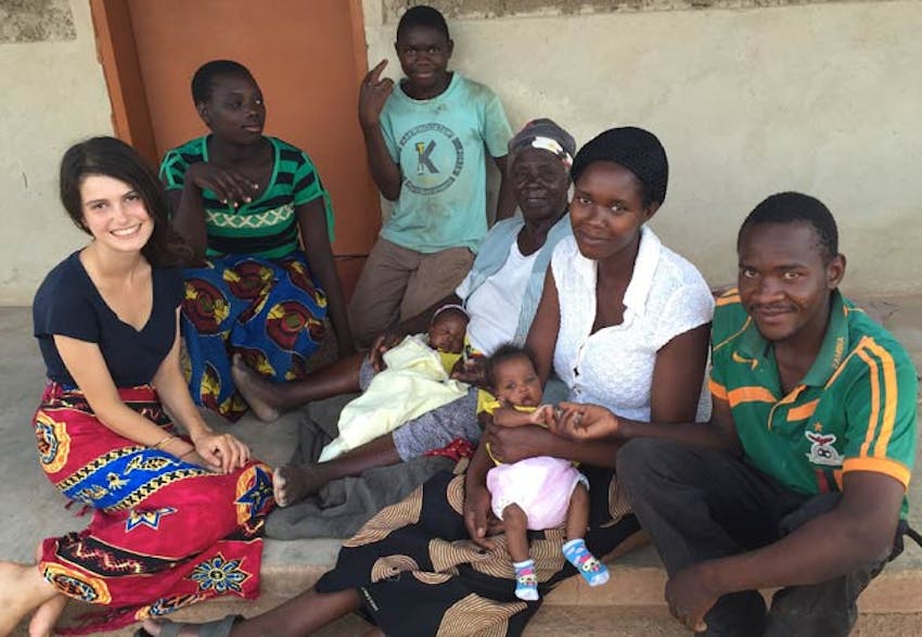 An IVHQ volunteer in Zambia and her family