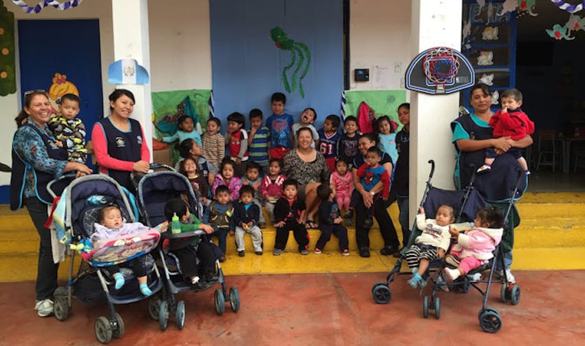 IVHQ volunteer, Sue, with the local childcare placement in Guatemala