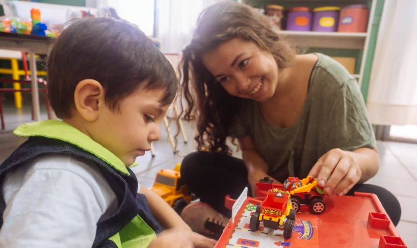 IVHQ volunteer playing games with Argentina child