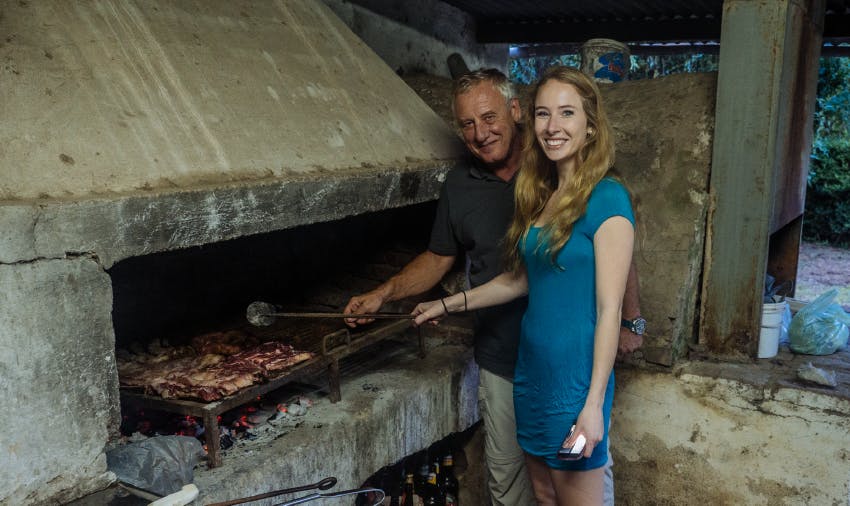 IVHQ volunteer helping with home BBQ