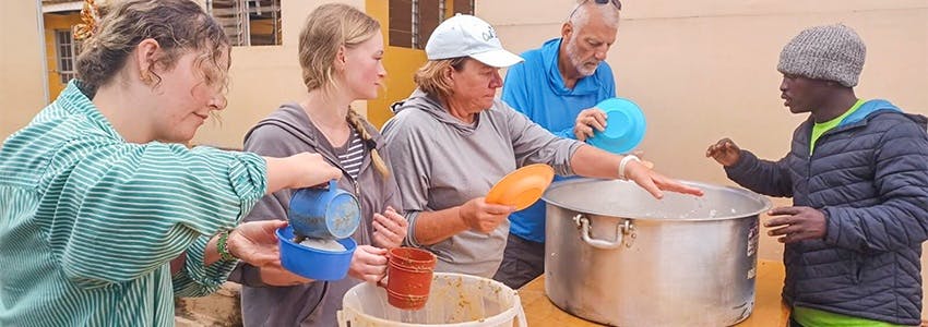 Volunteers serving food to those in need