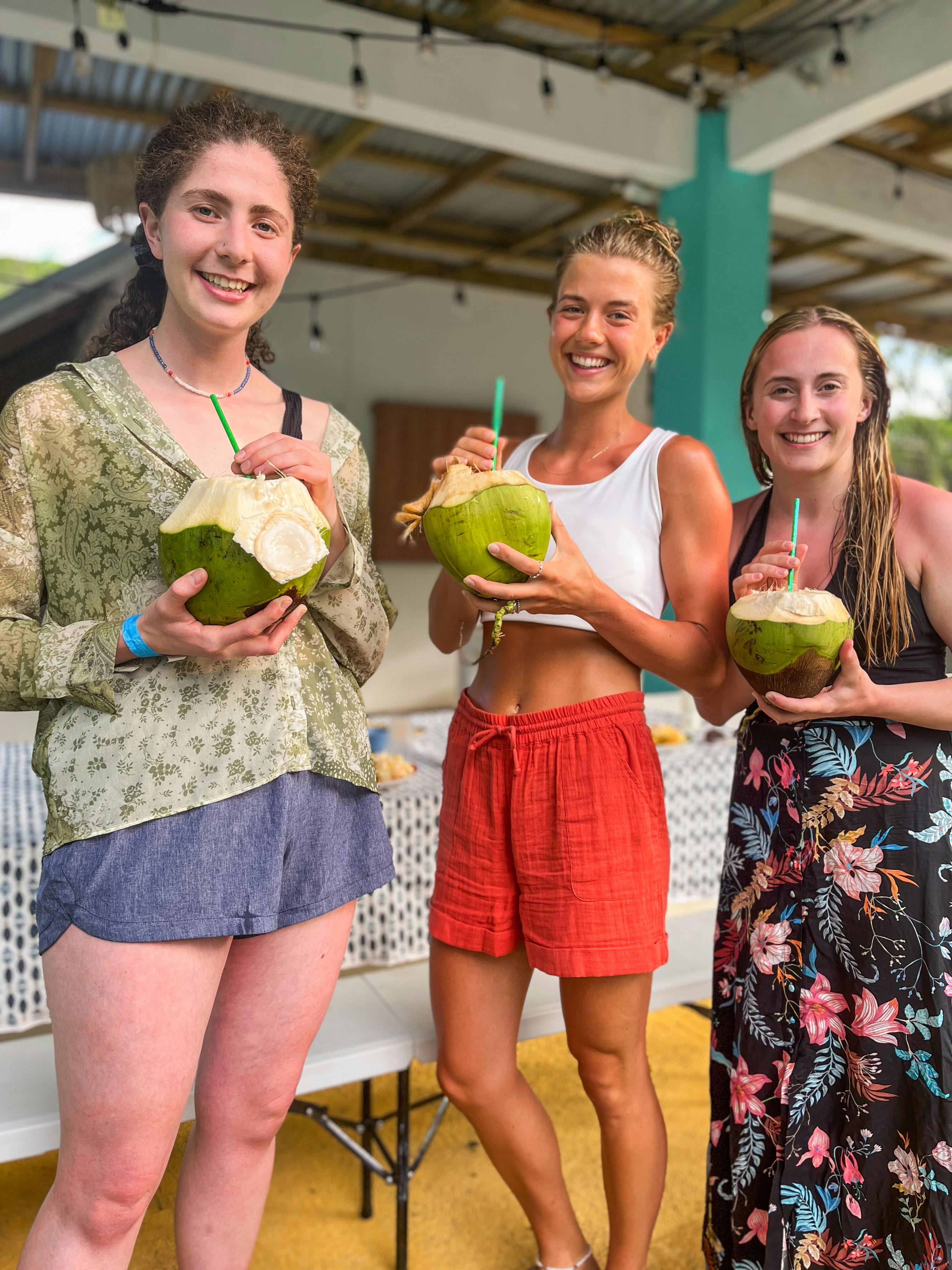 IVHQ Volunteers drinking coconut water during their free time in Jamaica