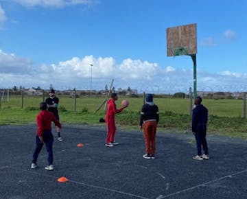 Playing netball on the Sports Volunteer project in South Africa with IVHQ