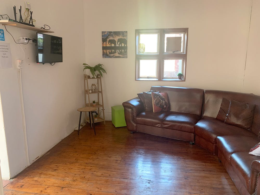 Living room at volunteer accomodation house in South Africa with IVHQ
