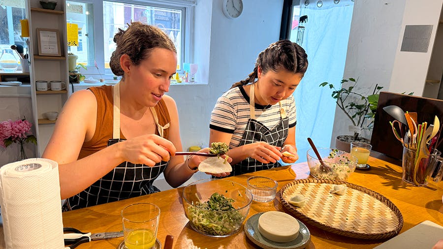 IVHQ volunteers making dumplings at the Culture week add-on in Seoul, South Korea