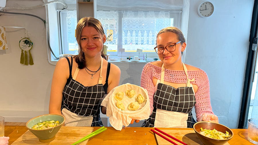 IVHQ volunteers showing the dumplings they made at the Culture week add-on in Seoul, South Korea