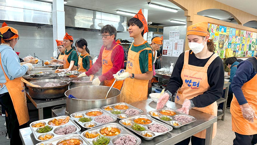 Volunteers meal preparing at the Soup Kitchen volunteer project in Seoul, South Korea with IVHQ