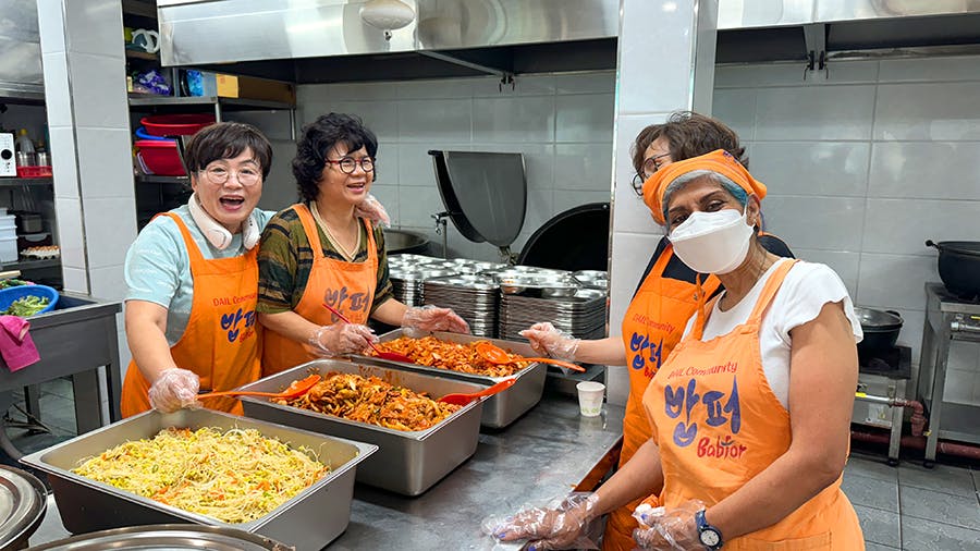 IVHQ volunteers getting along together during Soup Kitchen project in Seoul, South Korea