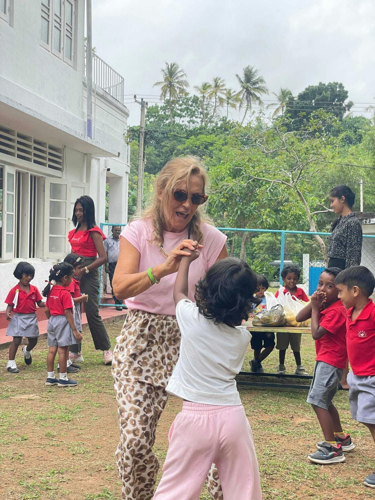 A senior IVHQ volunteer dancing at a local daycare center in Hikkaduwa