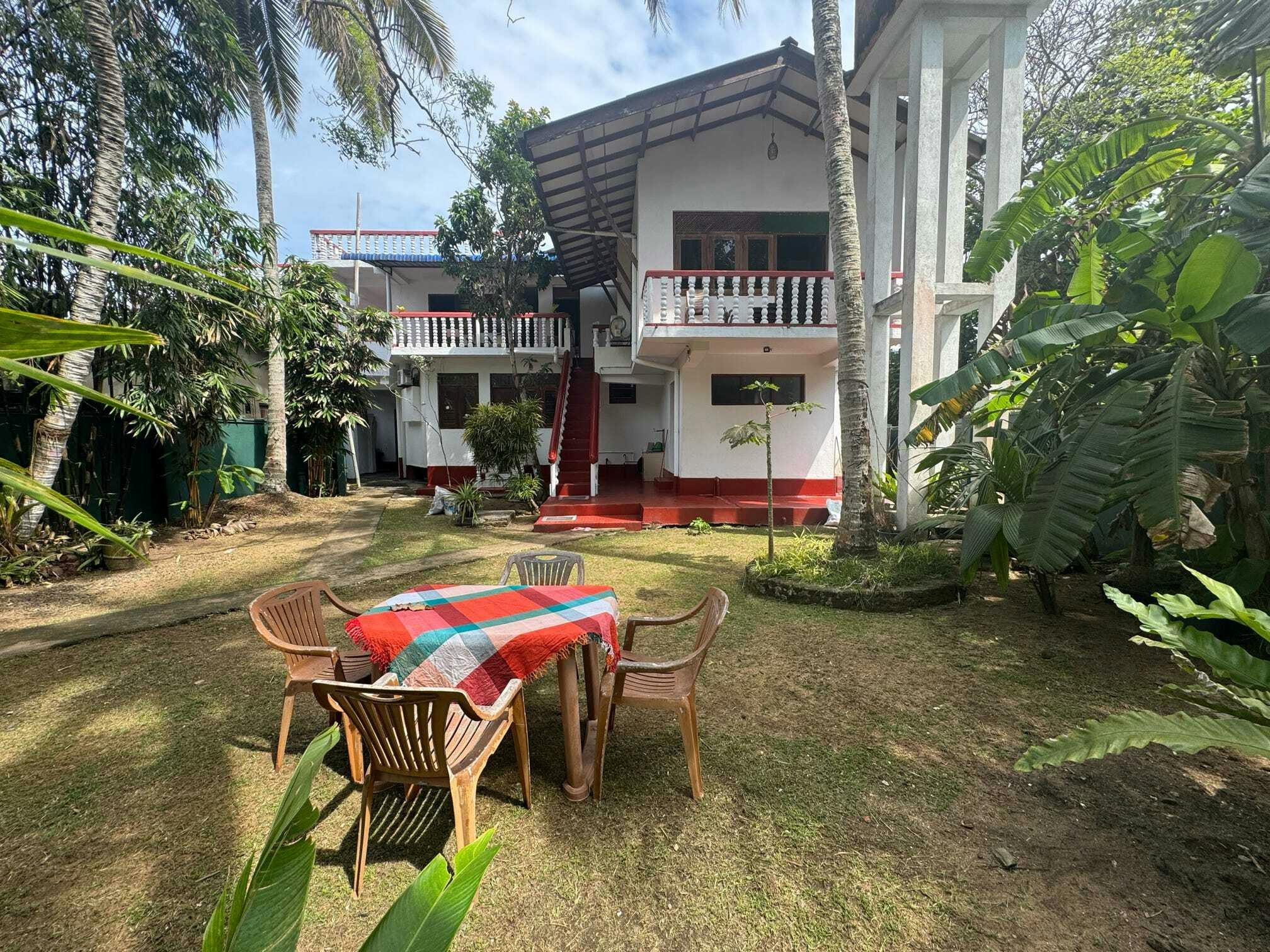 Home away from home. The volunteer accommodation in Hikkaduwa has a lush garden and plenty of space to relax after a day of making a difference