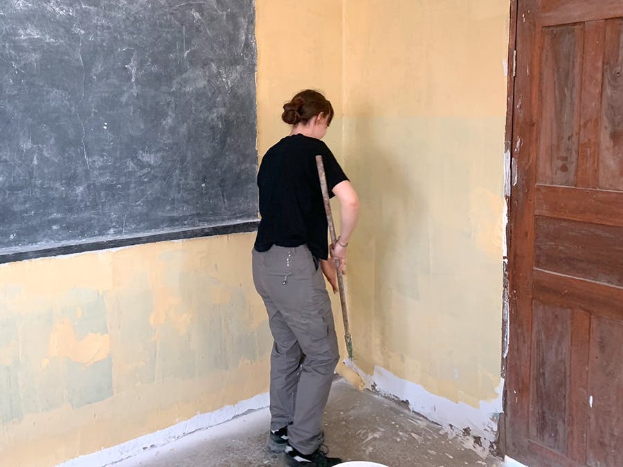 IVHQ construction volunteer working on site in Tanzania