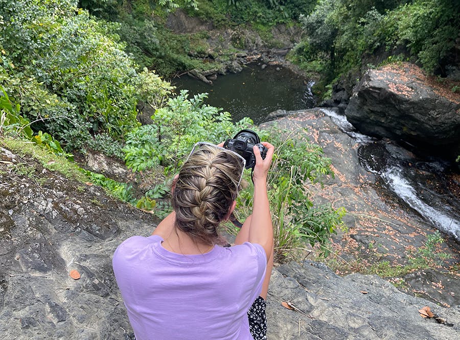 An IVHQ Trinidad and Tobago volunteer seeing and taking photos of Green Hill Waterfall on the weekend
