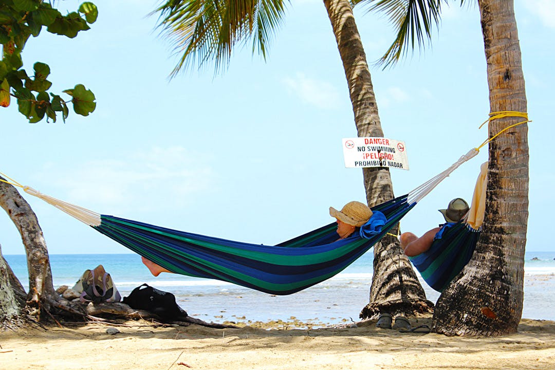 IVHQ Trinidad and Tobago volunteers relaxing in hammocks