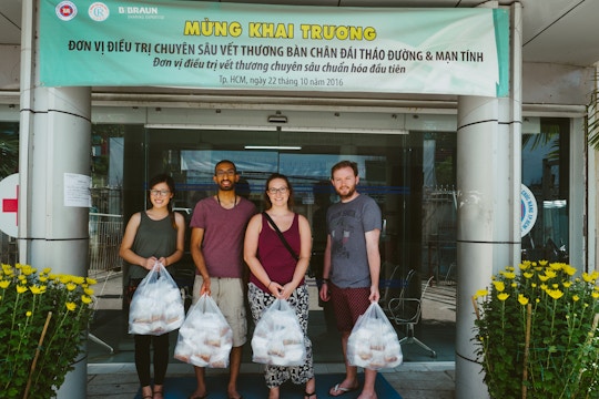 Group of volunteers on the Food Outreach volunteers with IVHQ in Vietnam