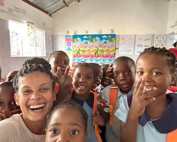 Volunteers having a joyful time with the local kids at the childcare project in Zambia with IVHQ