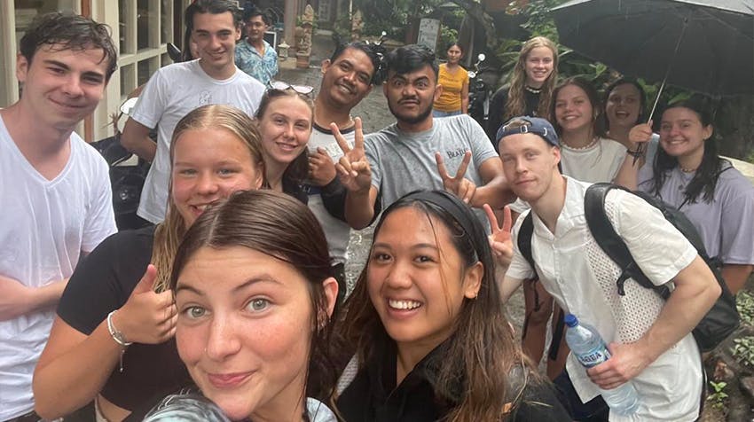 Jennifer and volunteers making friends at arrival in Bali with IVHQ.