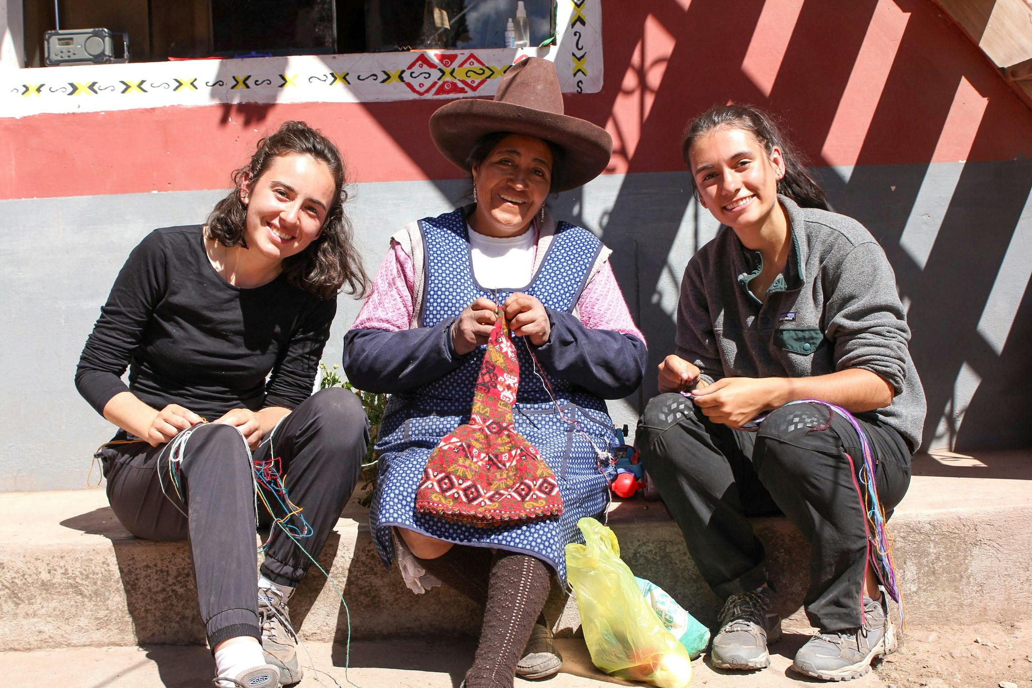 Two IVHQ volunteers with a Peruvian woman at the Women's Empowerment project in Peru - Cusco